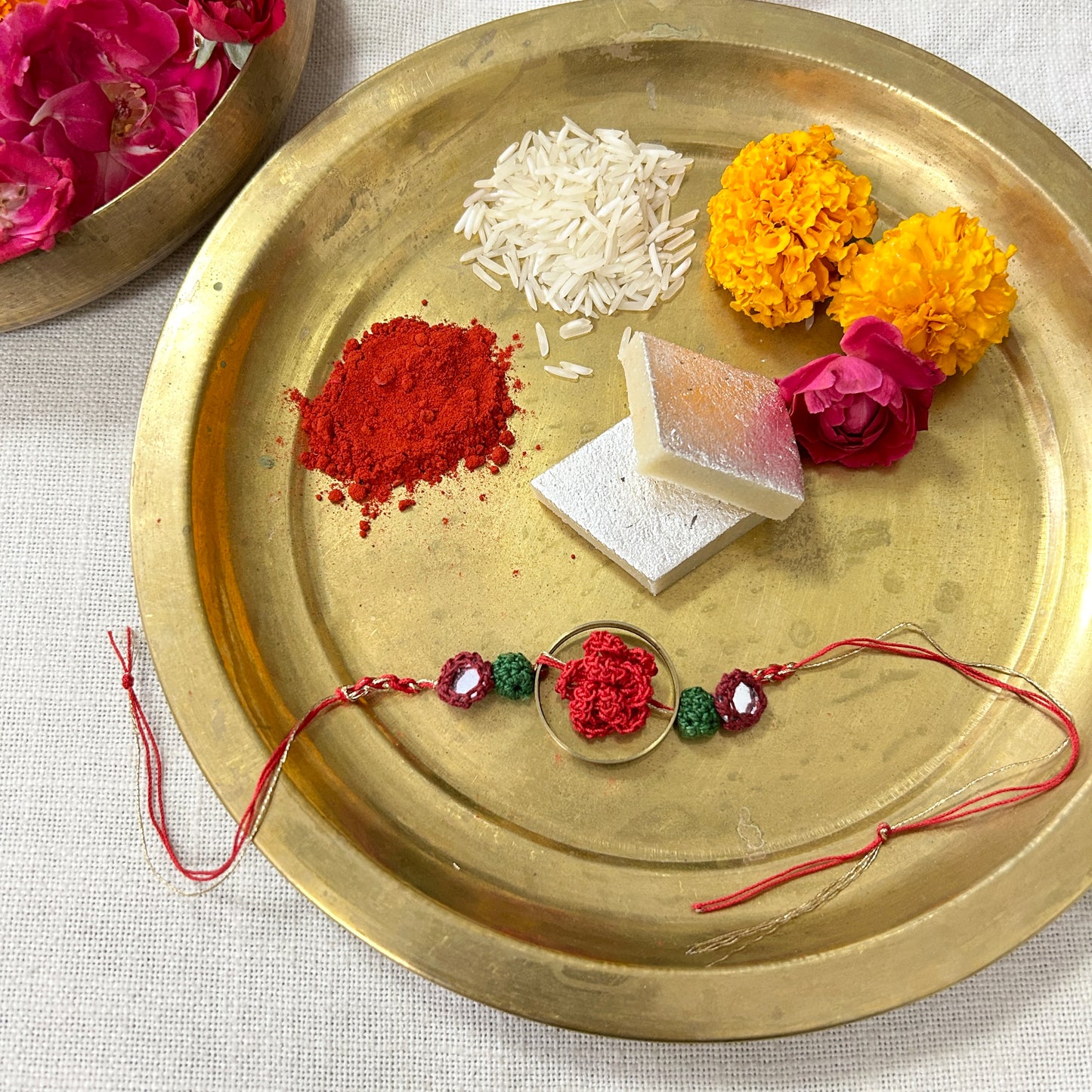 Crochet Rose in a Brass Ring Rakhi