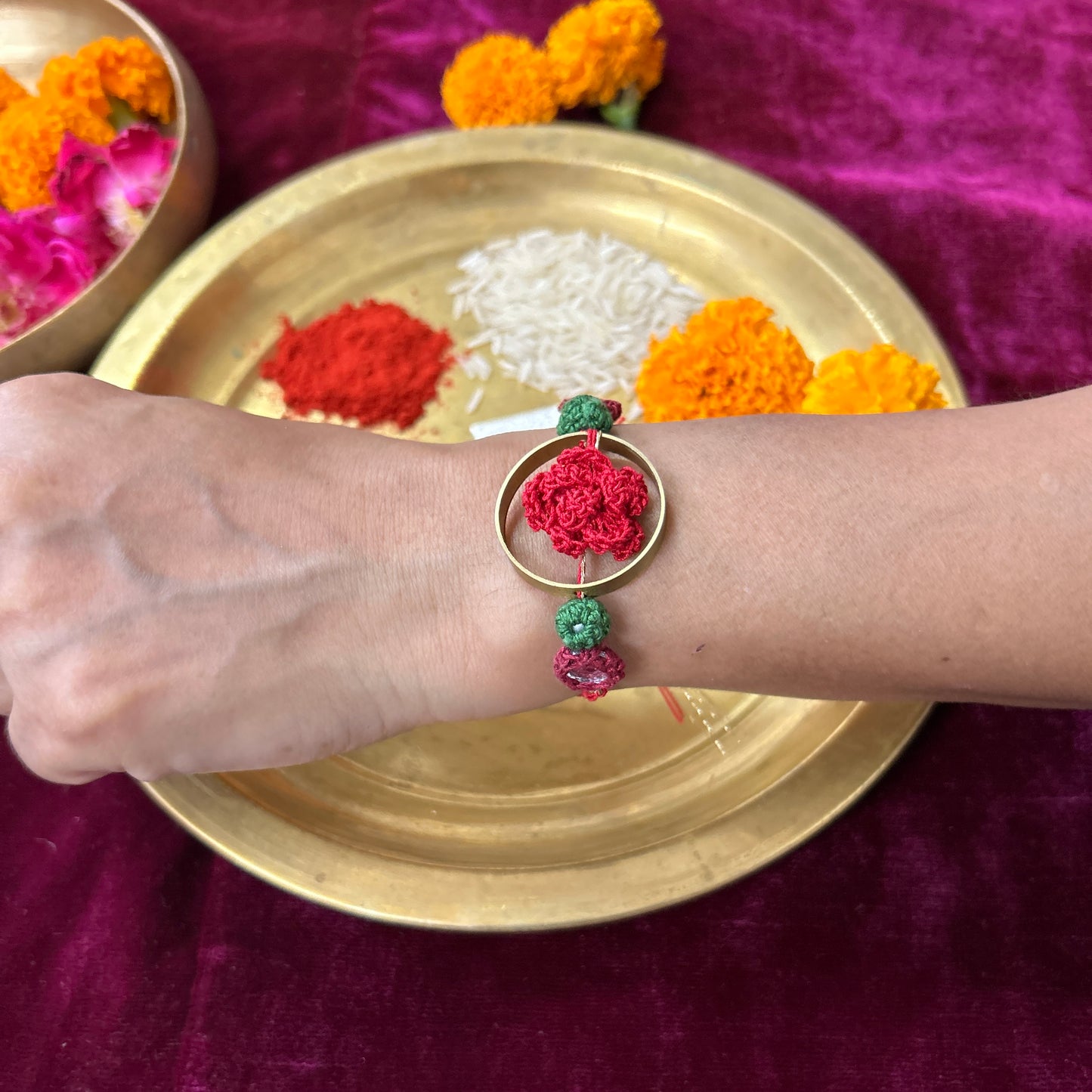 Crochet Rose in a Brass Ring Rakhi