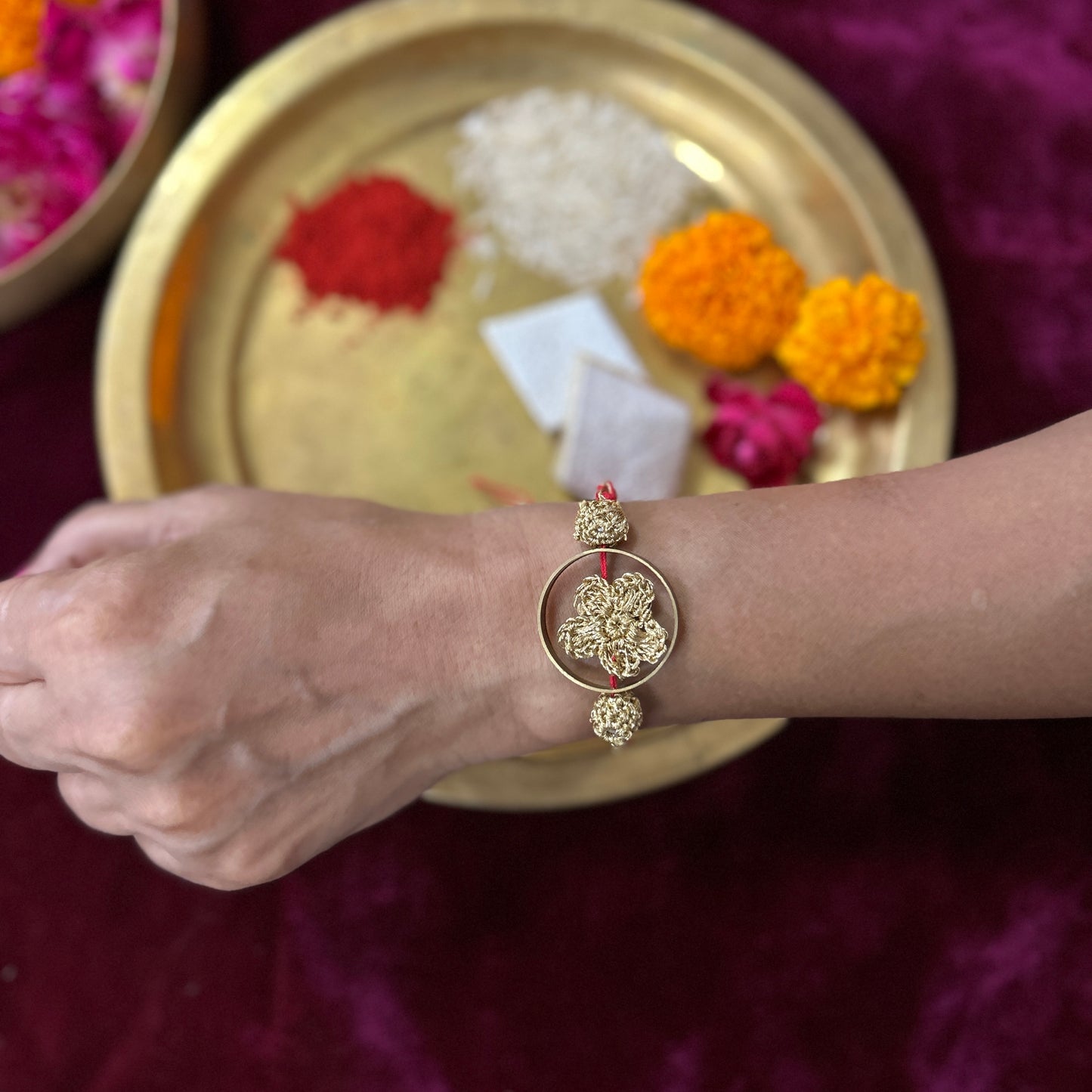 Golden Crochet Flower in a Brass Ring Rakhi