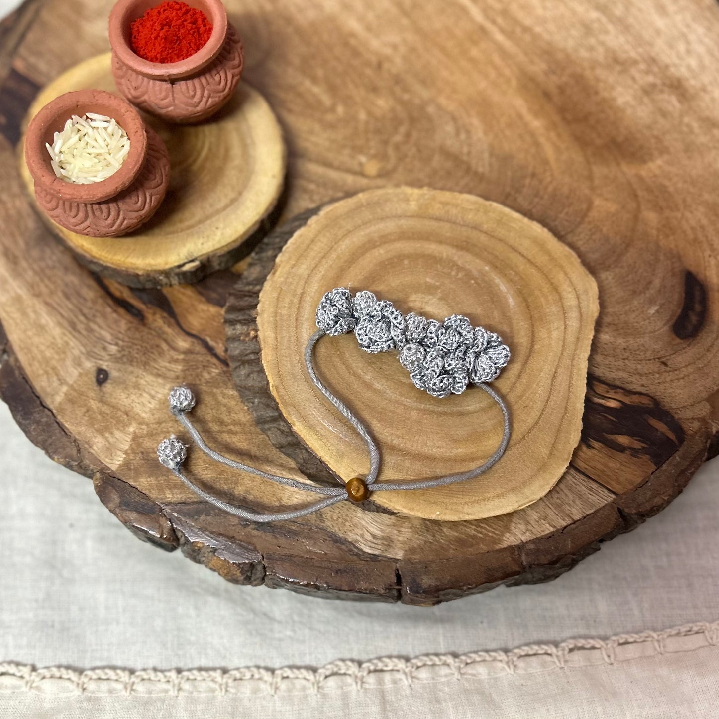 Silver zari crochet rakhi