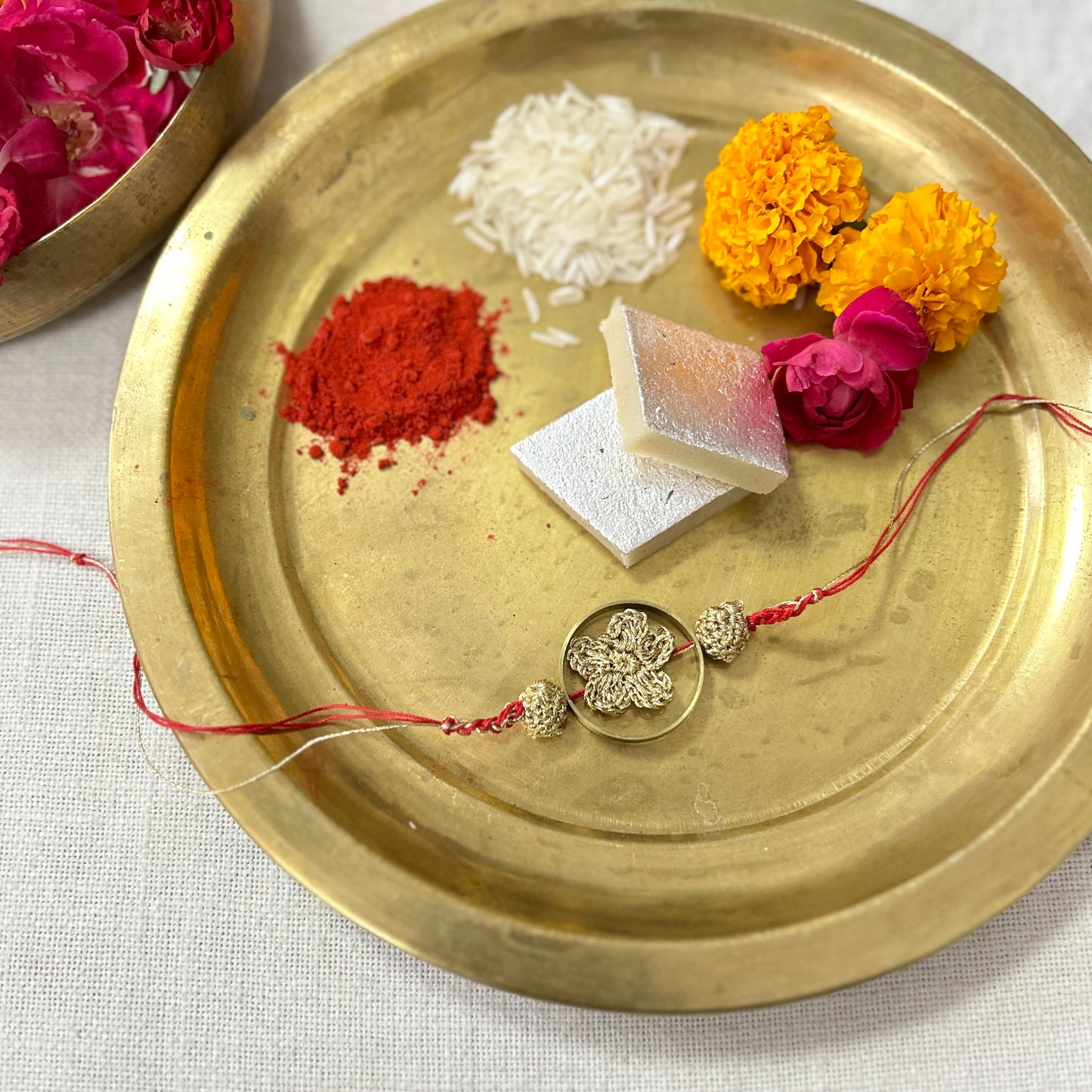 Golden Crochet Flower in a Brass Ring Rakhi