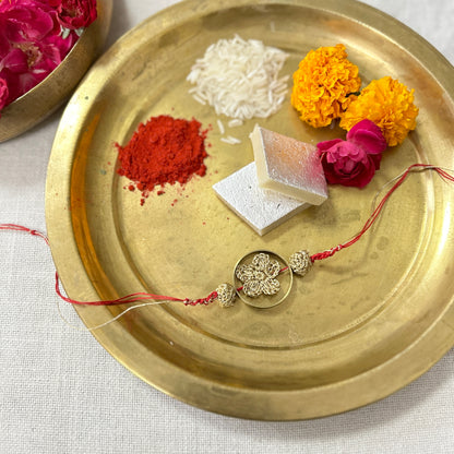 Golden Crochet Flower in a Brass Ring Rakhi